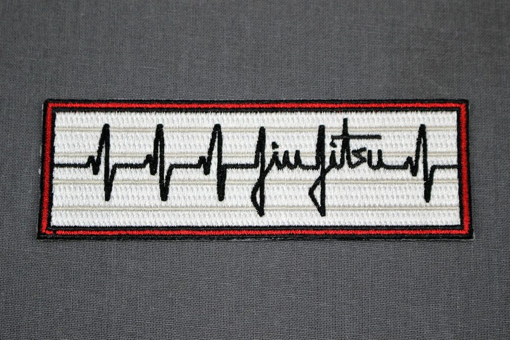 Bjj PULSE EKG embroidered patch on a dark gi
