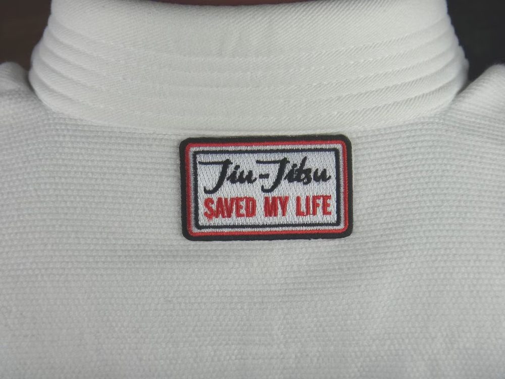 SAVED my Life embroidered patch on a dark gi